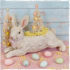 White leaping bunny planter made of textured resin with pink ears and bow vintage easter bunny figural decor