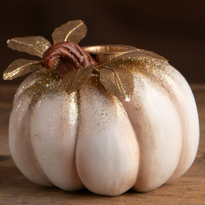 White pumpkin candlestick with gold glitter accents and metallic stem perfect for halloween candles and candle holders