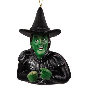 Green-skinned wicked witch of the west glass ornament by cody foster with black hat and glittery silver accents