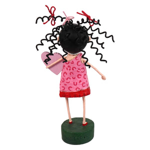 A wild about you wire sculpture by lori mitchell featuring a girl with black curly hair and a pink horseshoe dress from a family-owned folk art store