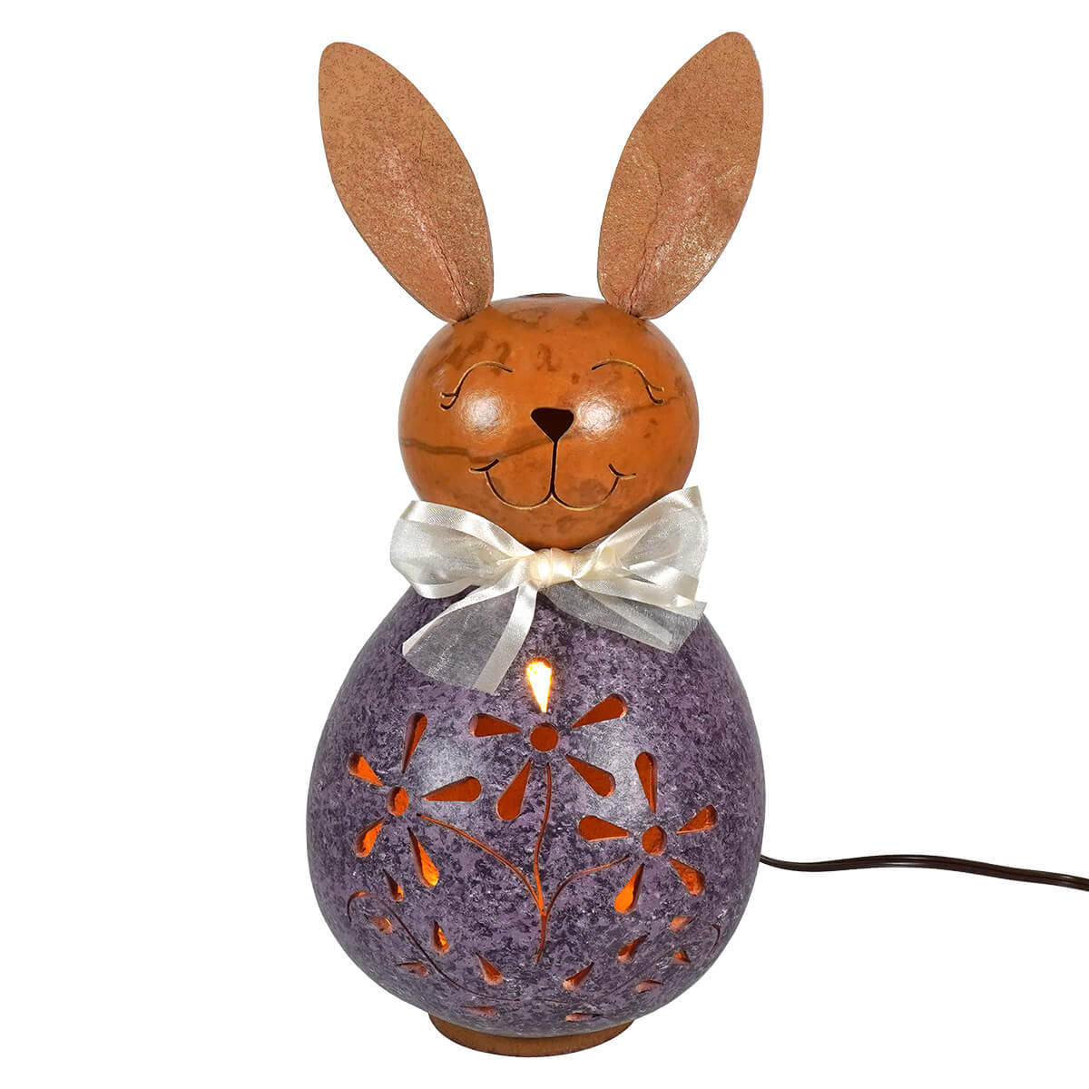 A charming purple and brown lighted bunny gourd lantern with flower cutouts and a white ribbon bow for easter bunny decor
