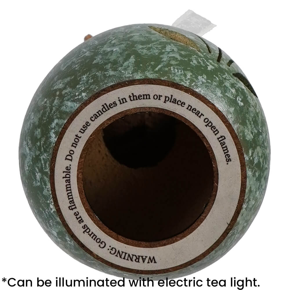 Green speckled ceramic birdhouse with circular opening and warning label from meadowbrooke bunny willow bunny gourd