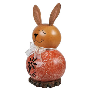 Cute orange willow bunny miniature gourd with brown ears white ribbon and black floral cutout by meadowbrooke gourds