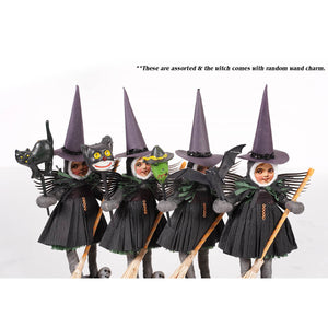 Five assorted winged witch figures with tall purple hats black pleated cotton dresses holding brooms spun cotton witch