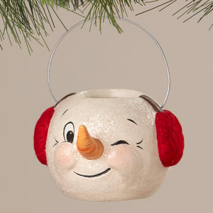 A cheerful white snowman bucket ornament with red earmuffs and glittery texture perfect for christmas buckets and lanterns