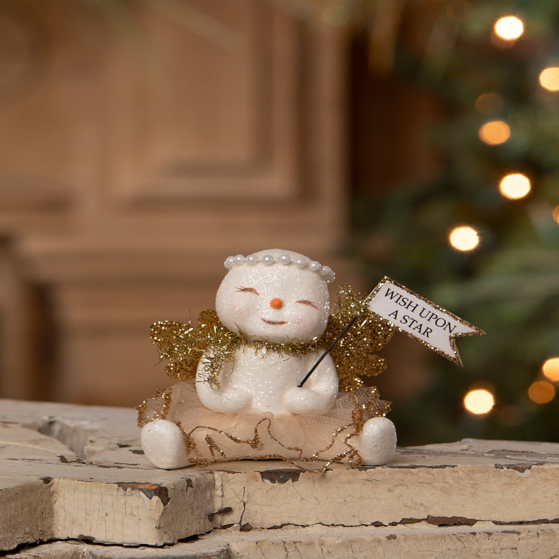 White ceramic star snow angel figurine by bethany lowe designs with gold wings and pearl headband holding wish upon a star flag
