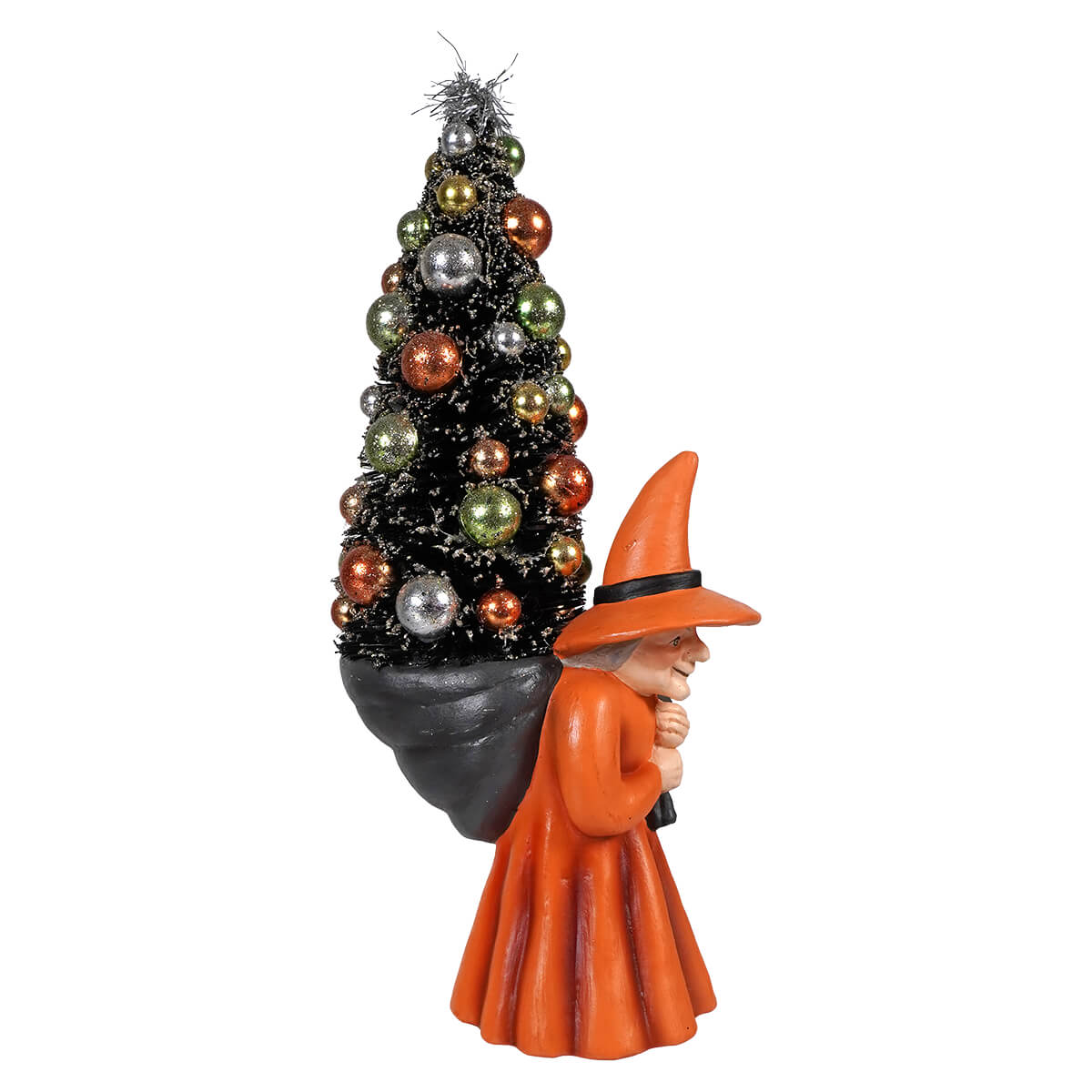 Orange witch carrying tree figurine holding a black christmas tree with colorful ornaments halloween witches decor