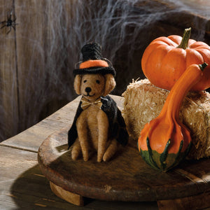 A tan felt teddy bear wearing a black witch hat and cape with a gold bow tie from kathy’s halloween collection witch critter