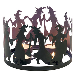 Black metal witches circle candle holder with three lit tealight candles from kathys halloween collection seasonal candle holder