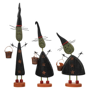 Three whimsical witch figurines with black hats red glitter trim and olive-green faces witches three gang by dan dipaolo design american folk art