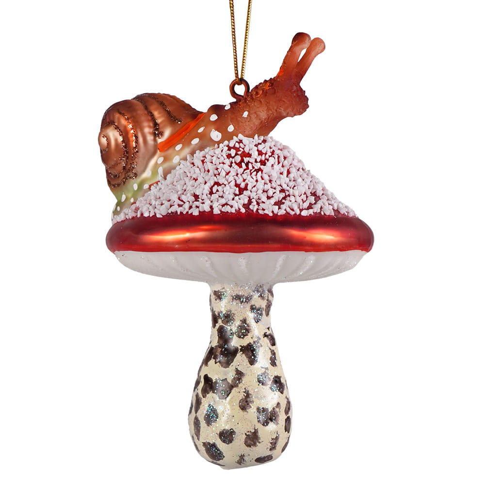 Woodfield snail atop red mushroom glass ornament with glossy red cap white stem and copper-colored snail garden ornament