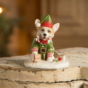 A charming bethany lowe figural decor corgi puppy in elf outfit holding candy canes perfect as tree toppers