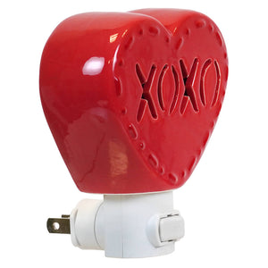 Glossy red ceramic heart night light with xoxo cut out and stitching details perfect for valentine’s day decor