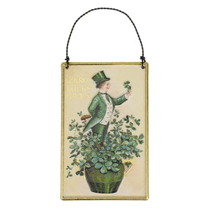 Green clover leprechaun ornament with gold trim and black cord spreading holiday cheer from a family-owned store