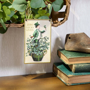 Zero lucks given ornament is a cream rectangular plaque with a vintage patrick’s day design spreading holiday cheer