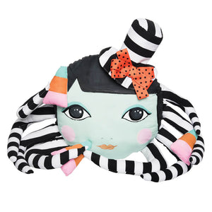 A plush zhi zhu zombinaland decorative pillow with a mint green octopus face and striped tentacles by tracy scheff