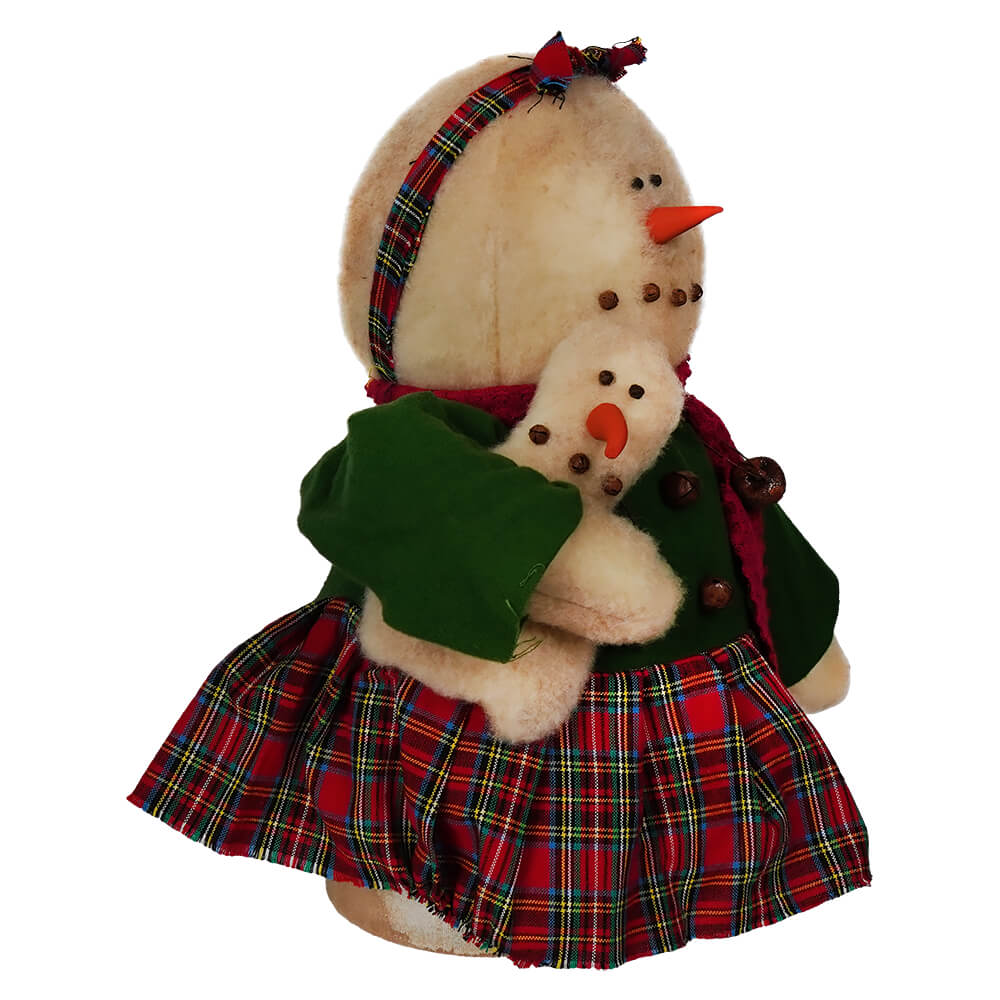 Snowgirl In Plaid Dress Holding Snowman Doll